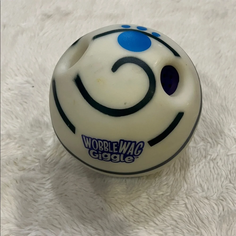 Slightly used Wobble Wag Giggle dog toy made of durable hard plastic.